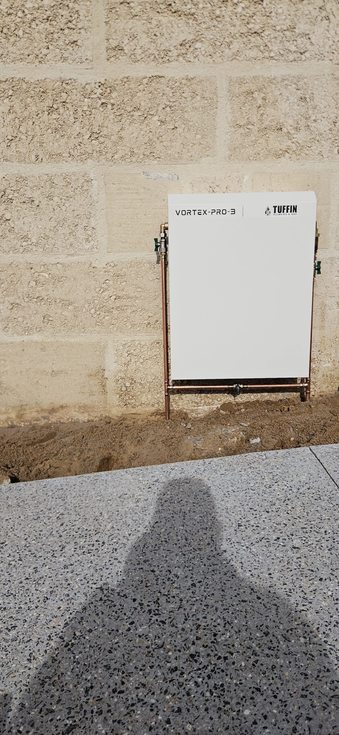 Vortex Pro 3 whole home water filtration system installed on a limestone wall in Dunsborough
