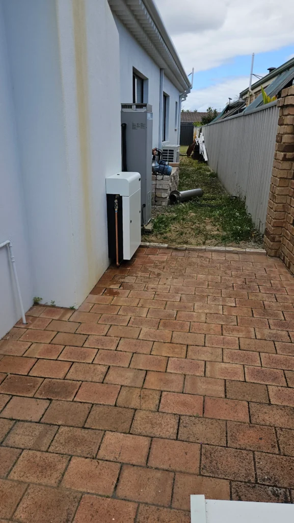 Vortex Pro 3 installed beside the hot water system down the side of a Bunbury home