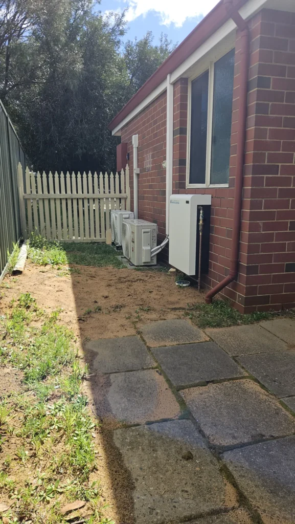 Whole-home water filter on the service side of a Dunsborough holiday house