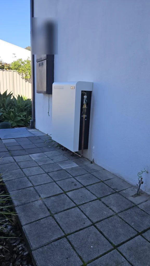 Side view of the Vortex Pro 3 installed flat against a rendered wall