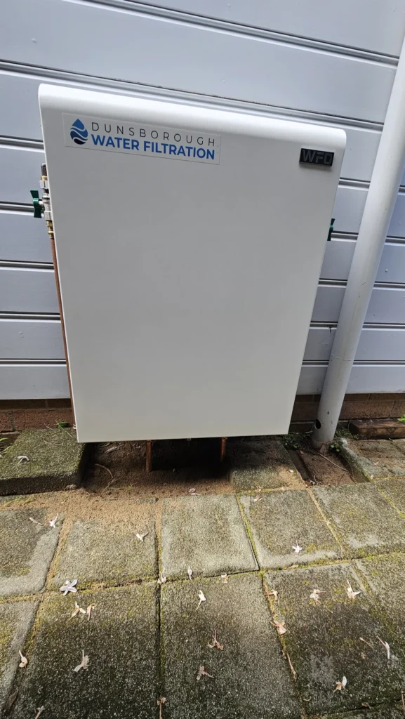 Dunsborough Water Filtration Vortex Pro 3 mounted on a weatherboard wall