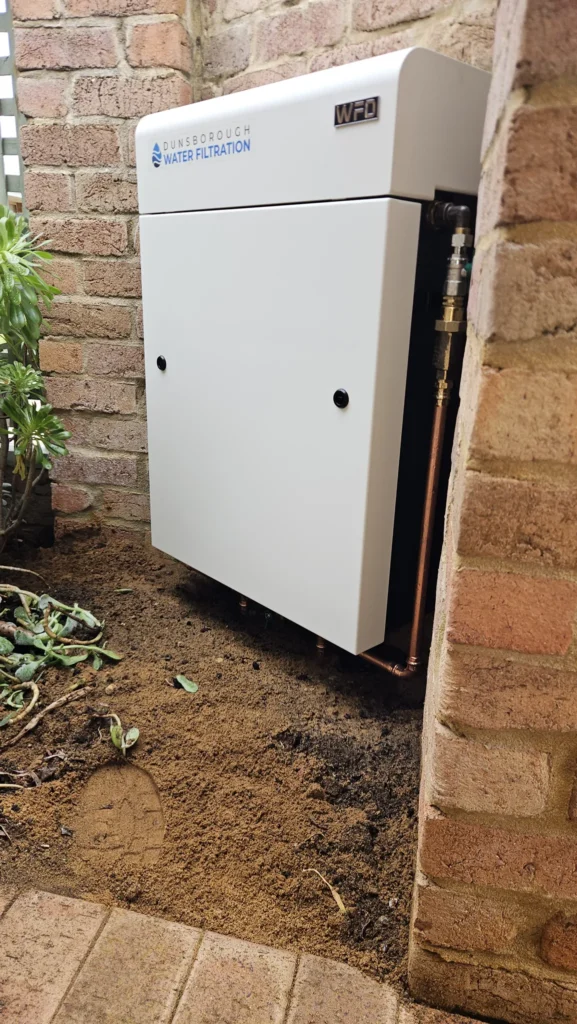 Side view of the Vortex Pro 3 and copper pipework in the brick nook