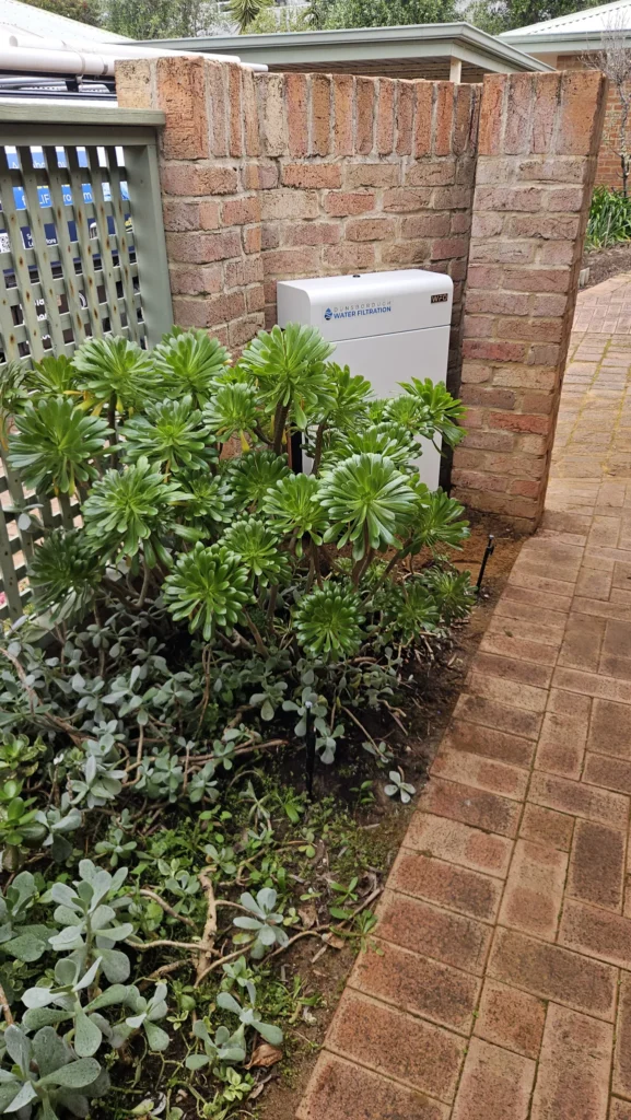 Vortex Pro 3 tucked in beside the garden bed and paved path