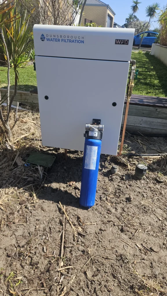 Old blue filter housing in front of the new Vortex Pro 3, before and after
