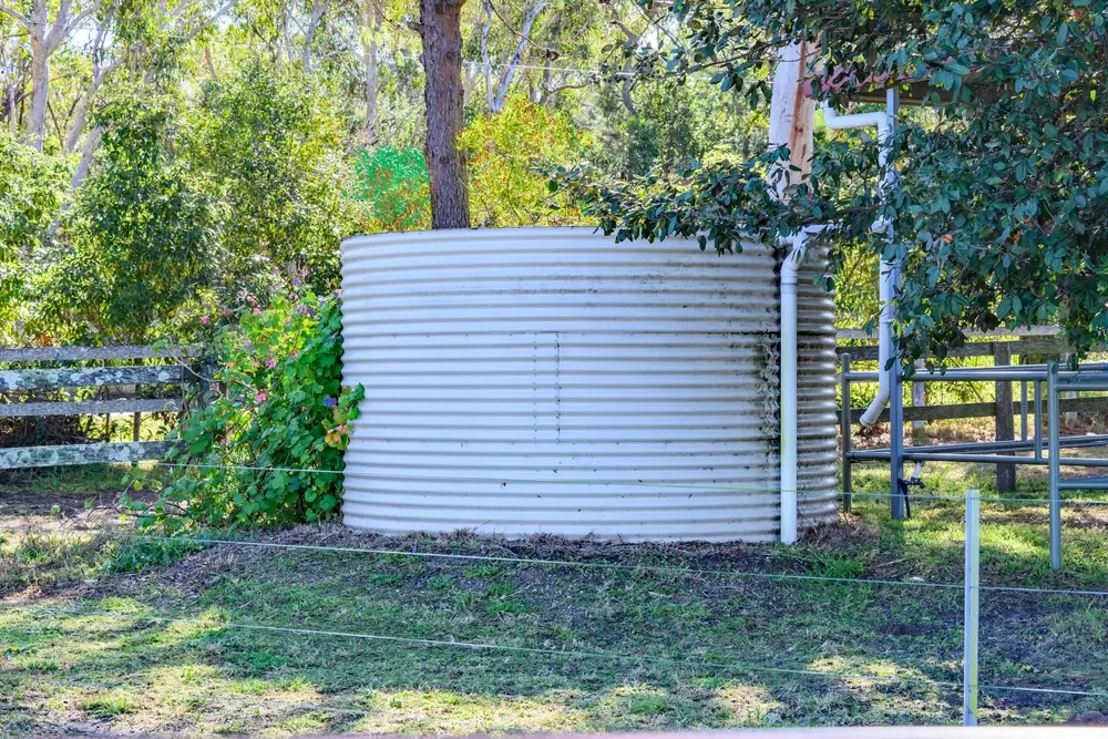 Rain water storage tank in rural setting